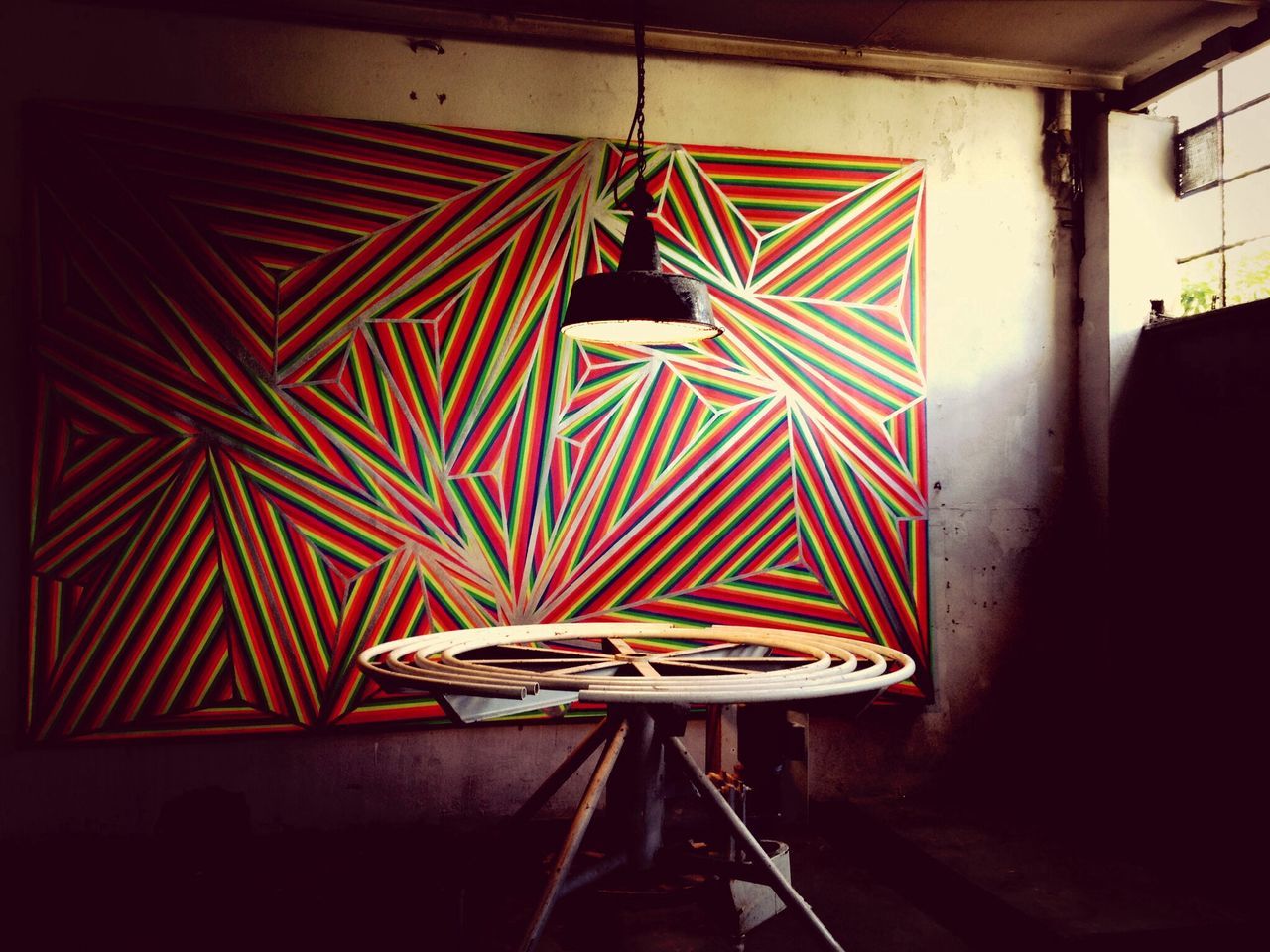 indoors, hanging, built structure, absence, wall - building feature, architecture, illuminated, art and craft, art, red, lantern, creativity, wall, decoration, empty, no people, multi colored, graffiti, chair, store