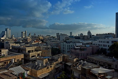 High angle view of buildings in city against sky