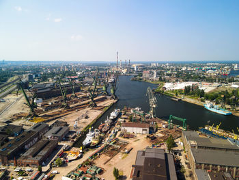 High angle view of road by buildings in city against sky