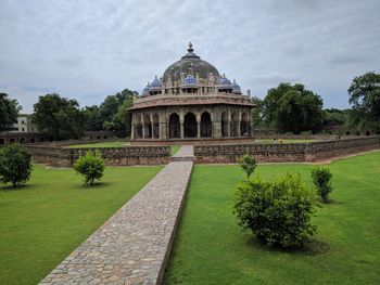 View of historical building against cloudy sky