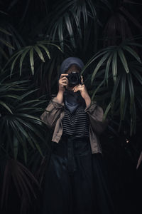 Young man photographing