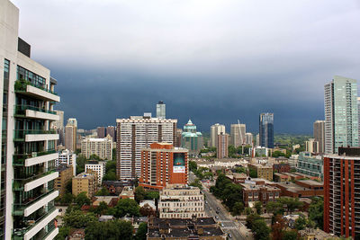 High angle view of buildings in city against sky