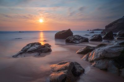 Scenic view of sea against sky during sunset