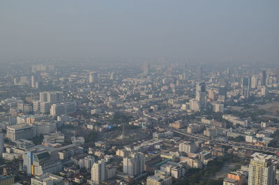 High angle view of buildings in city against clear sky