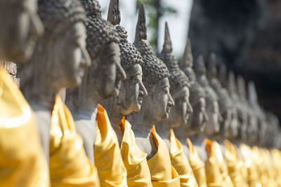 Buddha statues in row at wat yai chai mongkhon