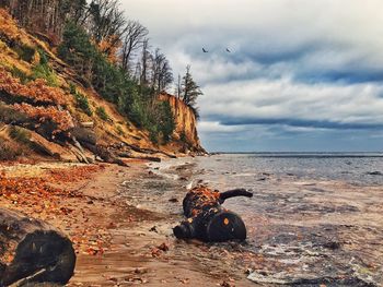 Scenic view of sea against cloudy sky