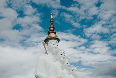 Low angle view of statue against sky