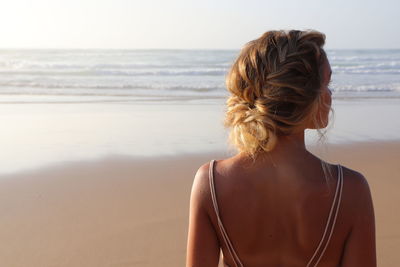 Rear view of woman looking at sea