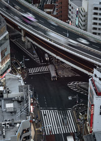 High angle view of vehicles on road in city