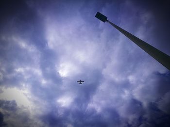 Low angle view of airplane flying in sky