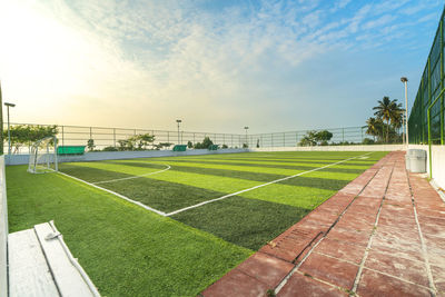 Scenic view of soccer field against sky