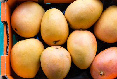 Full frame shot of mangoes for sale at market stall