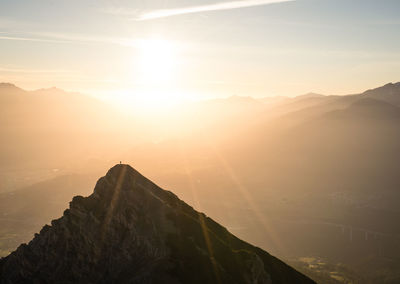 Scenic view of mountains against sky during sunset