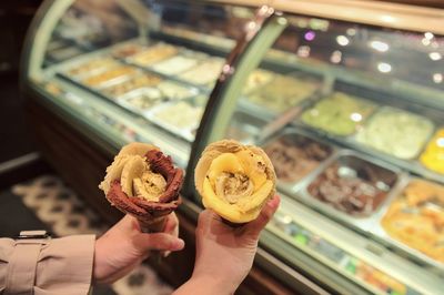 Midsection of woman holding ice cream