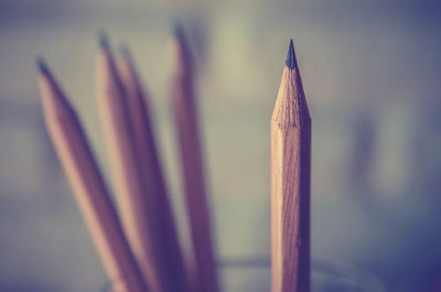 Close-up of pencils in desk organizer on table