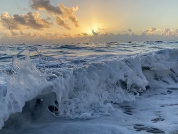 Scenic view of sea against sky during sunset