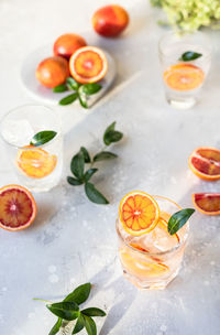 Hard seltzer cocktail with blood orange. cocktail or lemonade with citrus. low alcohol mocktails. 