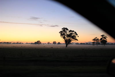 Scenic view of landscape at sunset