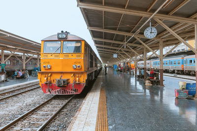 Train at railroad station against sky