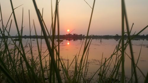Scenic view of lake against sky during sunset