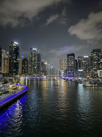 High angle view of illuminated buildings in city at night