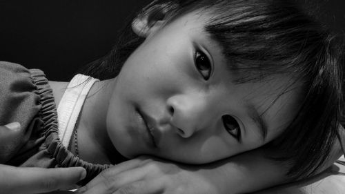 Close-up portrait of cute girl at home