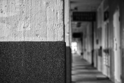 Close-up of footpath against wall in building