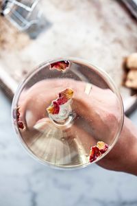 Cropped hand of person pouring water