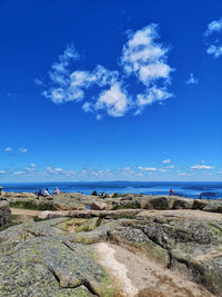 Scenic view of sea against blue sky