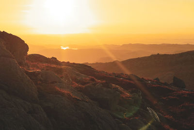 Scenic view of mountains against sky during sunset