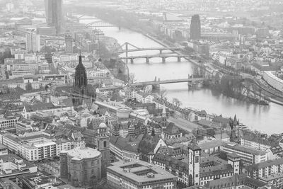 High angle view of river and buildings in city