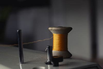 Close-up of machine part on table