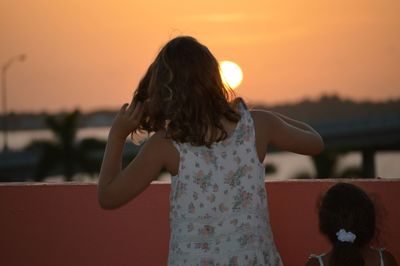 Woman looking at sunset