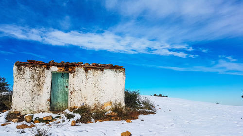 Built structure against blue sky during winter