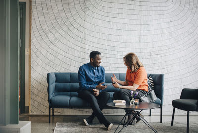 People sitting on chair at home