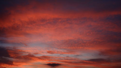 Low angle view of dramatic sky during sunset