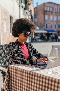 Young freelancer woman working on lap top computer