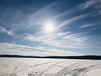 Scenic view of snowcapped landscape against sky