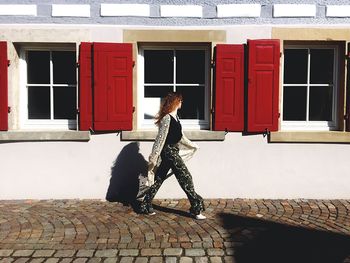Woman in front of building