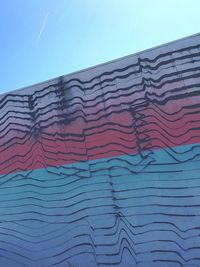 Low angle view of building against blue sky