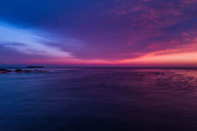 Scenic view of sea against sky at sunset