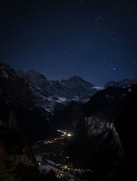 Scenic view of landscape against sky at night