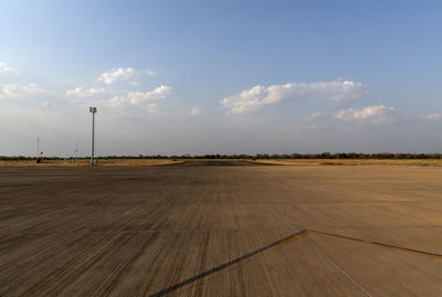 Scenic view of runway at airport against sky