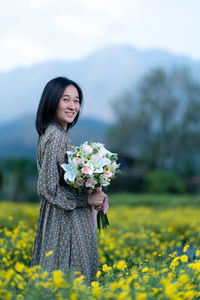 Beautiful woman standing on field