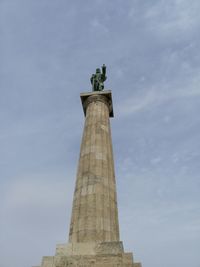 Low angle view of statue against sky