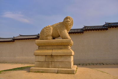 Statue of buddha against sky