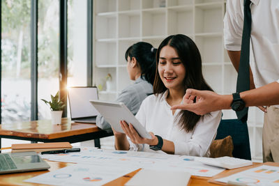 Business colleagues working at office