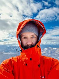 Portrait of boy standing on snow