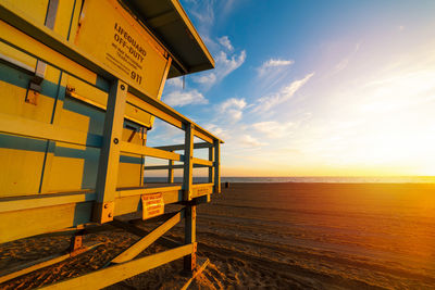 Scenic view of beach against sky during sunset