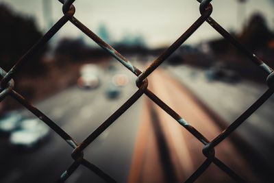 Full frame shot of chainlink fence over street 